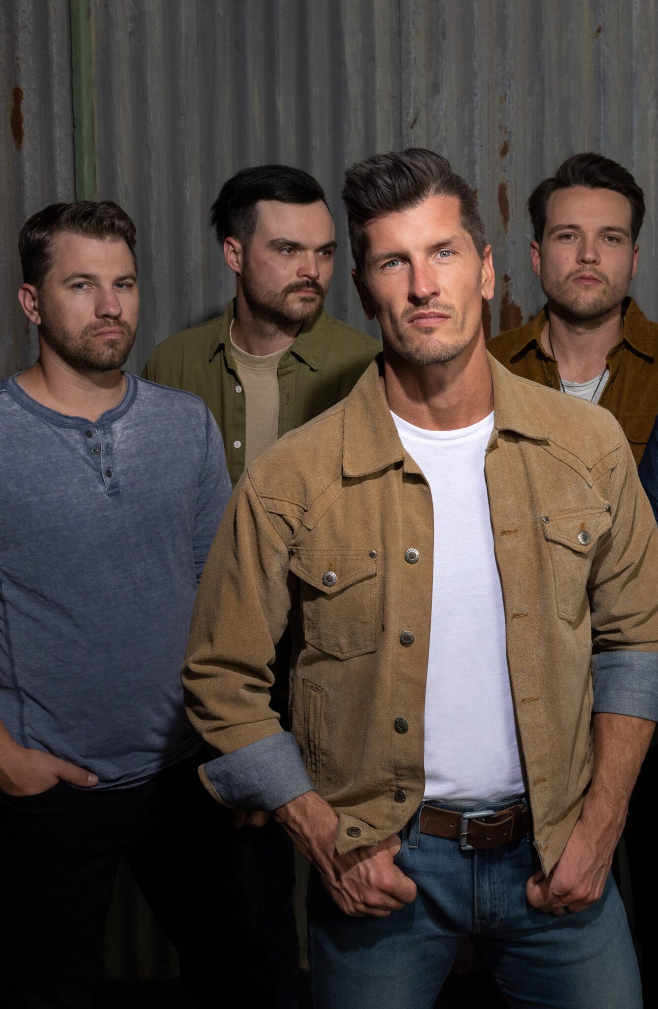 A band photo of High Valley with the four male band members posing casually