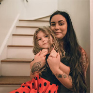 woman sitting on stairs with child